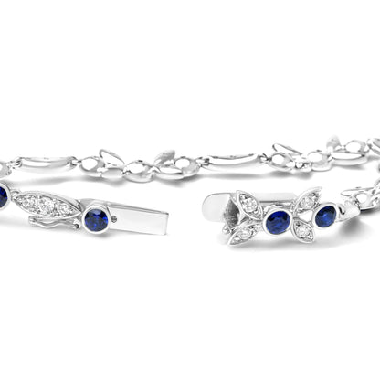 18K White Gold 1 3/4 Cttw Diamond and 3x3mm Round Blue Sapphire Gemstone Floral Link Bracelet (G-H Color, SI1-SI2 Clarity) - Size 7"